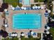 Overhead view of the large rectangular community pool, surrounded by lounge chairs and landscaping at 10416 Skye Arroyo Ave, Las Vegas, NV 89166