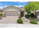 Charming single-story home featuring a brick driveway, desert landscaping, and a two-car garage at 10416 Skye Arroyo Ave, Las Vegas, NV 89166