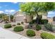 Charming single-story home features desert landscaping with stone accents and a two car garage at 10416 Skye Arroyo Ave, Las Vegas, NV 89166
