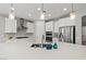 Kitchen boasts stainless appliances, an island with bar seating, and plenty of storage space at 10416 Skye Arroyo Ave, Las Vegas, NV 89166