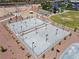 Aerial view of community sport courts featuring fencing, lighting, and paved surfaces at 10416 Skye Arroyo Ave, Las Vegas, NV 89166