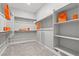 Walk-in closet featuring carpeting, shelves and bars for ample storage space at 10416 Skye Arroyo Ave, Las Vegas, NV 89166