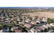 Overview of the residential area, displaying many homes and community desert space at 11082 Sospel Pl, Las Vegas, NV 89141