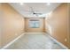 Spacious bedroom featuring tile floors and a ceiling fan at 11082 Sospel Pl, Las Vegas, NV 89141