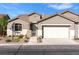 Charming single-story home with a two-car garage, landscaped front yard, and welcoming entrance at 11082 Sospel Pl, Las Vegas, NV 89141