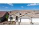 Beautiful single-story home with a two-car garage and desert landscaping, showcasing its appealing curb appeal at 11082 Sospel Pl, Las Vegas, NV 89141