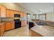 Kitchen with granite countertops, stainless steel appliances, and tile floors at 11082 Sospel Pl, Las Vegas, NV 89141