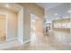 Open living area with neutral walls, tile floors, and lots of natural light at 11082 Sospel Pl, Las Vegas, NV 89141