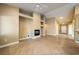 Open living room with tile floors and a fireplace feature at 11082 Sospel Pl, Las Vegas, NV 89141