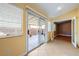 Bright sun room featuring large sliding glass doors leading to a covered patio and access to an interior room at 11082 Sospel Pl, Las Vegas, NV 89141