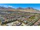An aerial view of the community showcases the scenic mountain views and proximity to shopping at 11672 Barga Ct, Las Vegas, NV 89138