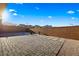 This backyard is fully fenced, beautifully landscaped, and finished with paver stones at 11672 Barga Ct, Las Vegas, NV 89138