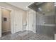 Bathroom featuring an open walk-in shower and two doorways for optimal access and privacy at 11672 Barga Ct, Las Vegas, NV 89138