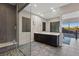 Spacious bathroom with walk-in shower, double vanity, large mirror, and neutral tones at 11672 Barga Ct, Las Vegas, NV 89138
