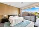 Beautiful bedroom with a large window offering plenty of natural light and a view of the outdoors at 11672 Barga Ct, Las Vegas, NV 89138