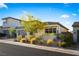 Stylish single-story home with a neutral color palette, desert landscaping, offering a serene and inviting curb appeal at 11672 Barga Ct, Las Vegas, NV 89138