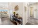 Welcoming foyer with stylish decor, console table, neutral walls, and tile flooring that leads to other living areas at 11672 Barga Ct, Las Vegas, NV 89138