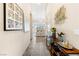 Inviting foyer with neutral decor, tile flooring, console table and artwork leading to the bright living spaces at 11672 Barga Ct, Las Vegas, NV 89138