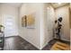 Entryway with console table, art, neutral walls, tile floors, and doors to other rooms for an inviting ambiance at 11672 Barga Ct, Las Vegas, NV 89138