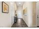 Bright entry featuring stylish console table and decor, artwork, neutral walls, and tile flooring at 11672 Barga Ct, Las Vegas, NV 89138
