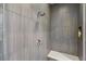 Close-up of a walk-in shower, showcasing the custom tile work, shower head, and built-in bench at 11672 Barga Ct, Las Vegas, NV 89138