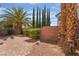 Private backyard featuring a brick patio and a mature tree at 1220 Padre Serra Ln, Las Vegas, NV 89134