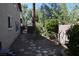 A serene backyard featuring stone pathways and lush landscaping for tranquil relaxation at 1220 Padre Serra Ln, Las Vegas, NV 89134