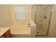Bright bathroom featuring a soaking tub and a glass-enclosed shower at 1220 Padre Serra Ln, Las Vegas, NV 89134