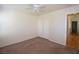 Bedroom with carpet, a ceiling fan, closet, and natural light from a side window at 1220 Padre Serra Ln, Las Vegas, NV 89134