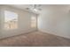 Bedroom with two windows and neutral carpet at 1220 Padre Serra Ln, Las Vegas, NV 89134