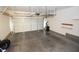 Spacious garage with a two-car garage door and ample room for storage at 1220 Padre Serra Ln, Las Vegas, NV 89134