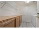 Practical laundry room with built-in storage, wire shelving, and washer at 1220 Padre Serra Ln, Las Vegas, NV 89134