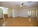 Spacious living room featuring hardwood floors, a staircase, and ample natural light at 1220 Padre Serra Ln, Las Vegas, NV 89134