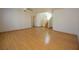 Bright, open living room with hardwood floors and access to the staircase at 1220 Padre Serra Ln, Las Vegas, NV 89134
