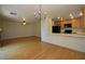 Spacious living room shows hardwood floors and a view into the kitchen area at 1220 Padre Serra Ln, Las Vegas, NV 89134