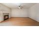 Cozy living room with a fireplace, hardwood floors, and plenty of space for furniture at 1220 Padre Serra Ln, Las Vegas, NV 89134