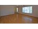 Bright living room with hardwood floors, large windows, and neutral walls at 1220 Padre Serra Ln, Las Vegas, NV 89134