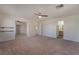 Open Primary bedroom with ceiling fan, carpet and doors to bathroom and walk-in closet at 1220 Padre Serra Ln, Las Vegas, NV 89134