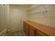 Functional mud room with storage cabinets, shelving, and tile flooring at 1220 Padre Serra Ln, Las Vegas, NV 89134