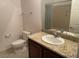 Bathroom featuring granite countertops, a white sink, and a vanity at 15 E Agate Ave # 202, Las Vegas, NV 89123