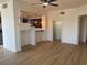 Bright living room with light wood flooring and adjoining kitchen with a convenient breakfast bar at 15 E Agate Ave # 202, Las Vegas, NV 89123