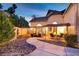 Charming backyard features a stone pathway, water fountain and patio with seating area at 15 Pheasant Ridge Dr, Henderson, NV 89014