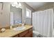 Bright bathroom vanity with cultured marble countertop, toilet and large framed mirror at 15 Pheasant Ridge Dr, Henderson, NV 89014