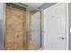 Modern bathroom with tile shower featuring glass doors, and tile walls and floors at 15 Pheasant Ridge Dr, Henderson, NV 89014