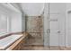 Elegant bathroom featuring a luxurious soaking tub and separate shower with built in bench seating at 15 Pheasant Ridge Dr, Henderson, NV 89014