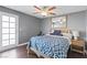 Bedroom with hardwood floors, ceiling fan and accent pillows, and a modern color scheme at 15 Pheasant Ridge Dr, Henderson, NV 89014