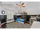 bedroom with ceiling fan, bunk beds, a window with lots of natural light and dark wood floors at 15 Pheasant Ridge Dr, Henderson, NV 89014
