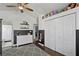 Cozy bedroom featuring a vaulted ceiling with fan, dark wood floors and ample closet space at 15 Pheasant Ridge Dr, Henderson, NV 89014