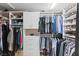 Spacious walk-in closet with custom shelving and storage solutions for clothes, shoes, and accessories at 15 Pheasant Ridge Dr, Henderson, NV 89014