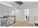 Second story hallway with white walls, white railing, and carpeted floors at 15 Pheasant Ridge Dr, Henderson, NV 89014